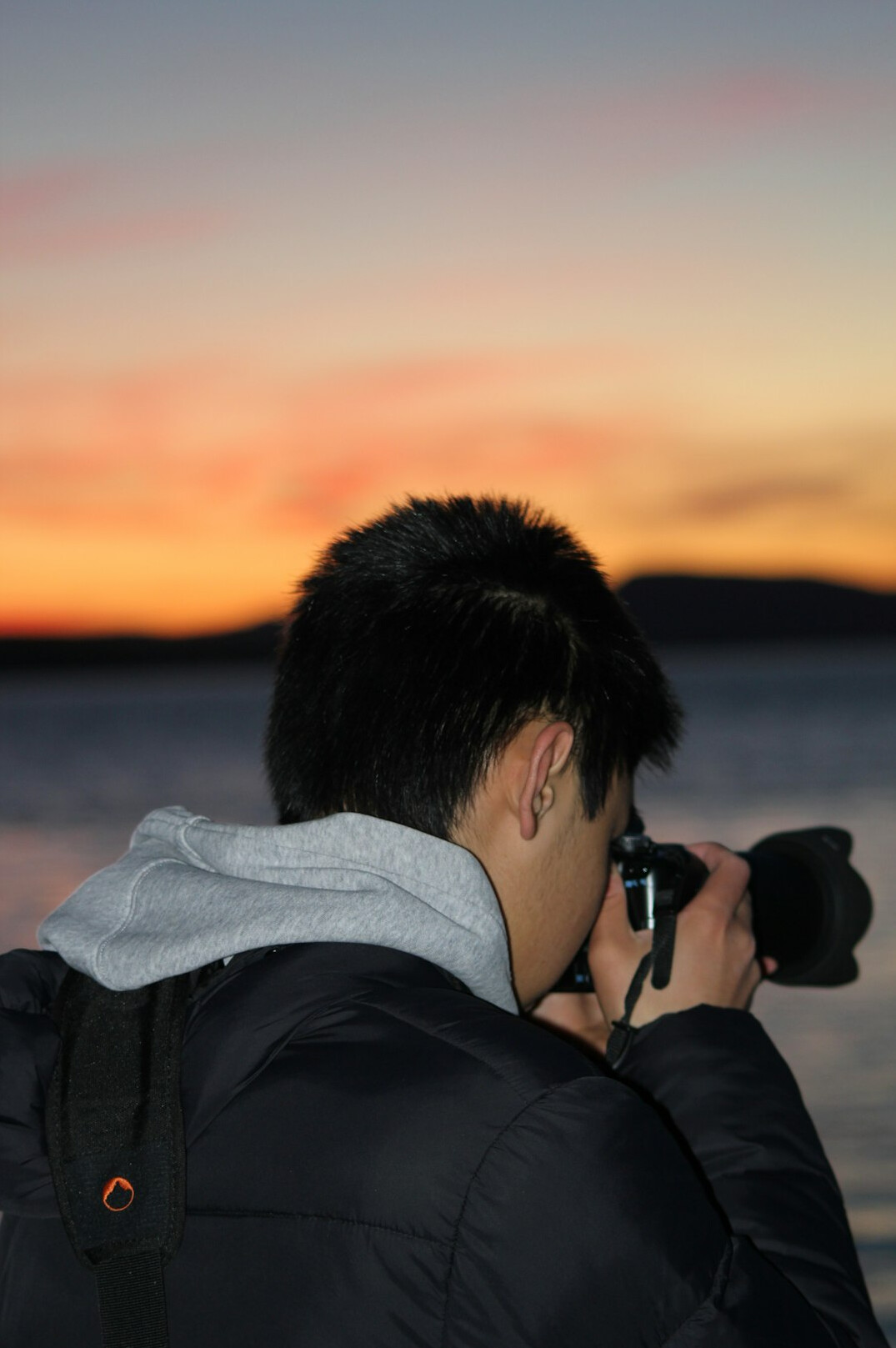 Photographer with camera at an evening event