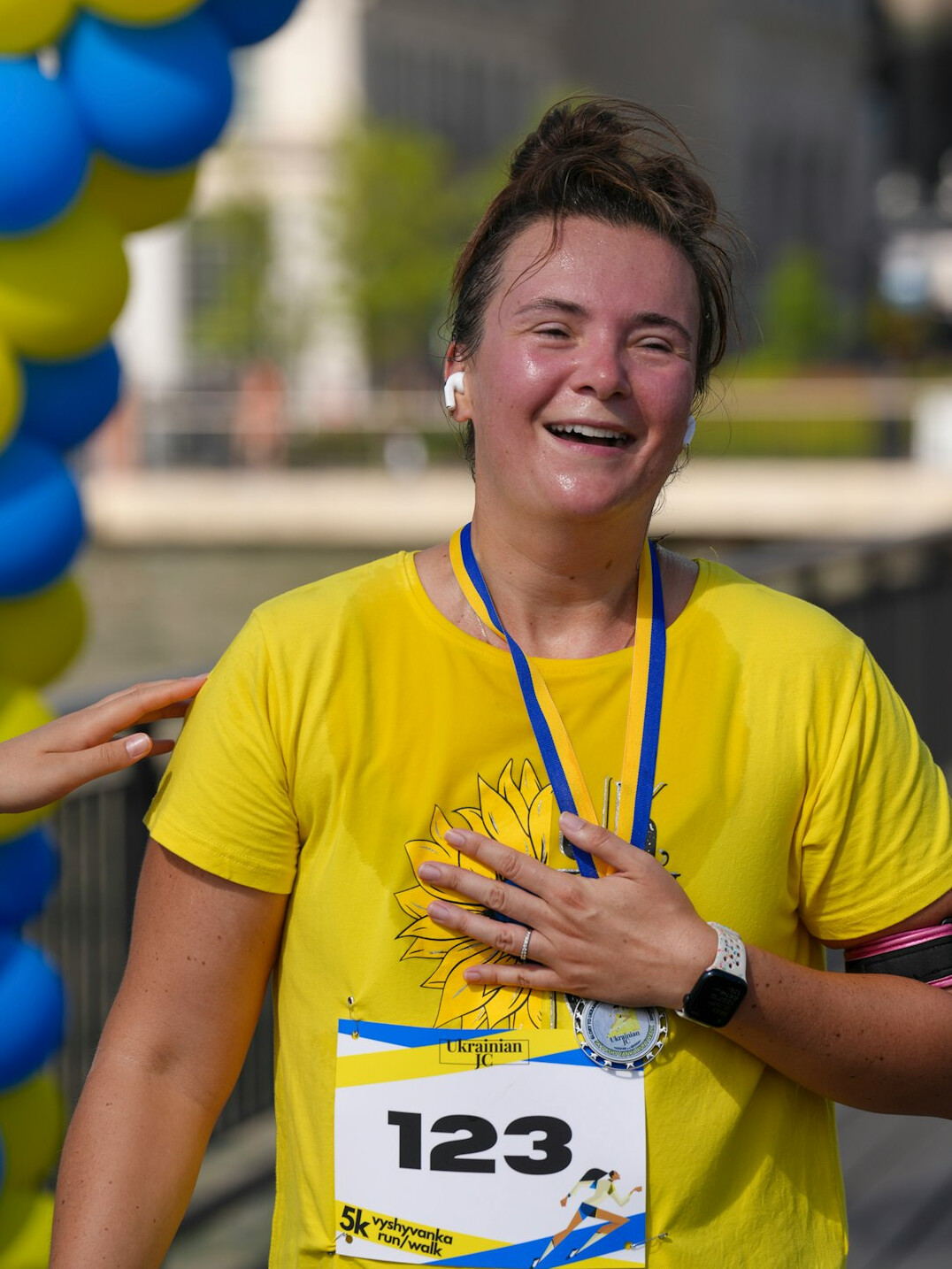 young runner crossing finish line