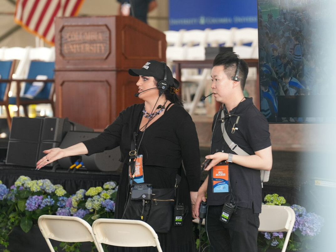 Reporter reviewing notes backstage