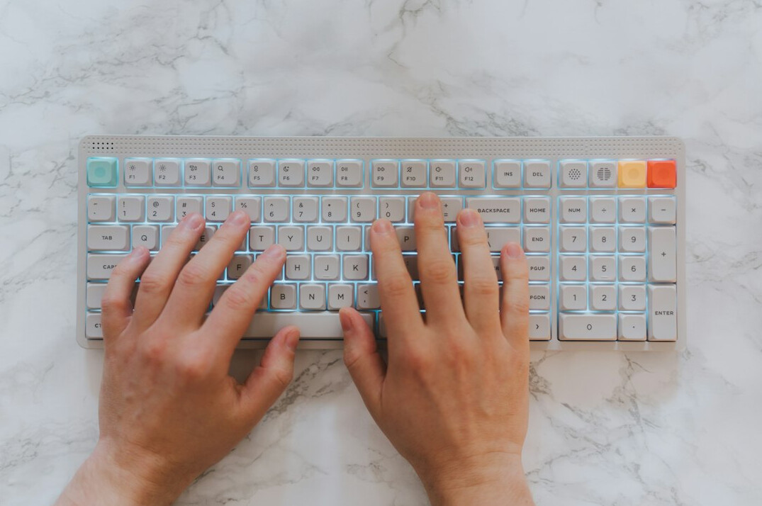 writer at desk typing